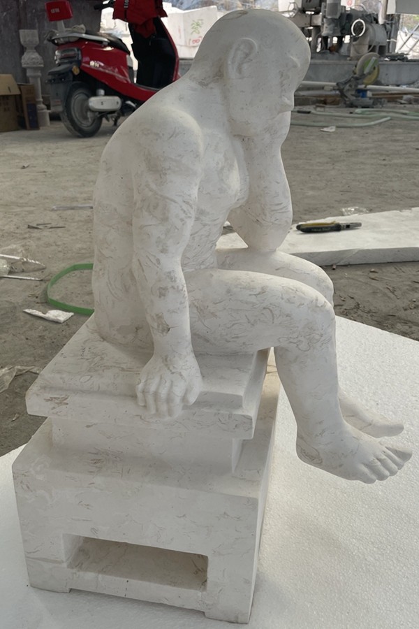 Sawn Limestone male seated statue